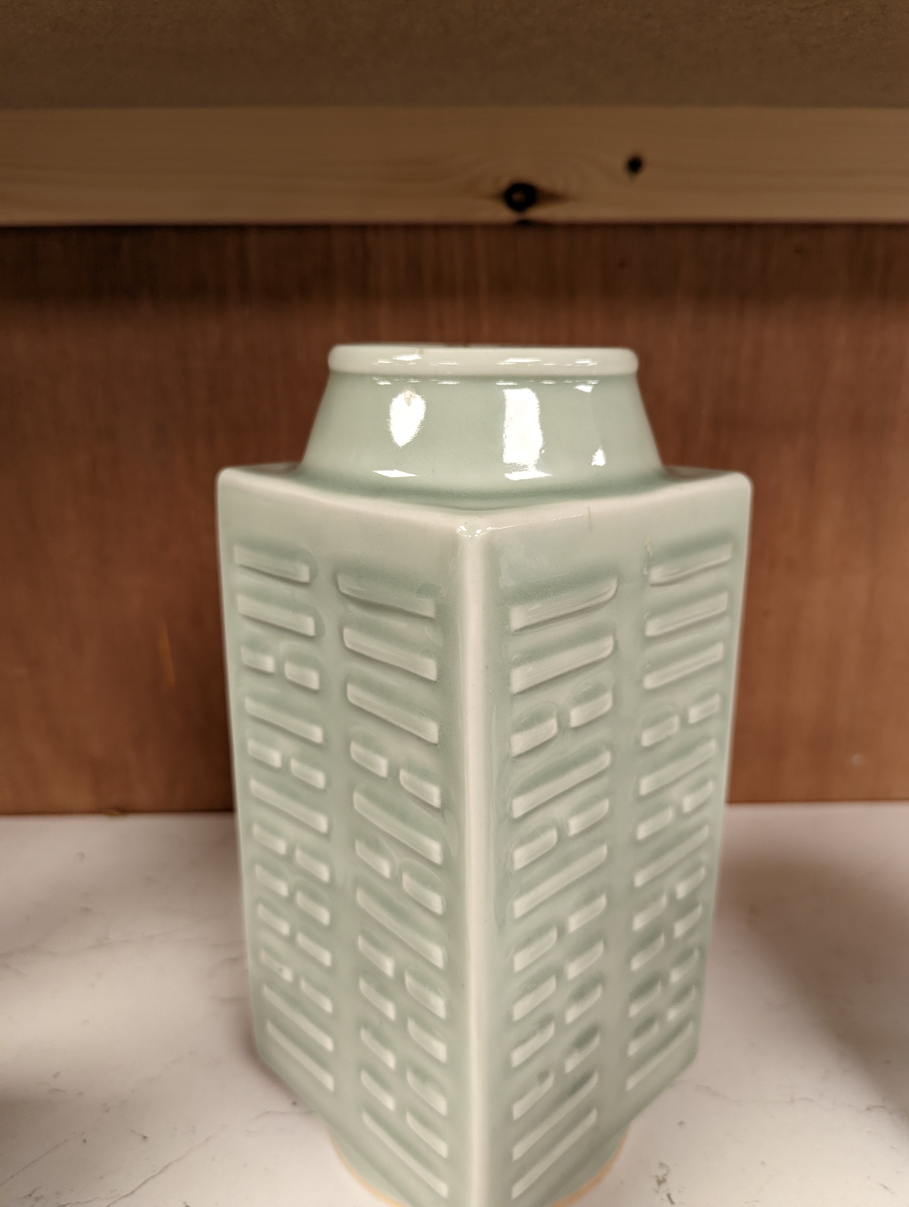 A Chinese celadon glazed eight trigrams cong shaped vase, Guangxu mark and possibly of the period. Provenance - owner bought in auction 20 years ago. 25cm tall